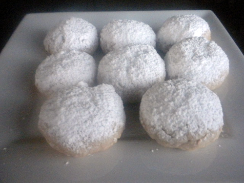 A close up of a plate with sugar cookies