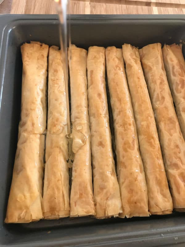 A tray of food, with Baklava and nuts