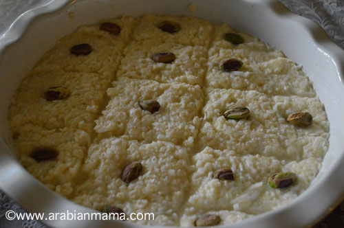 A pan of food with Bassema dessert and nuts