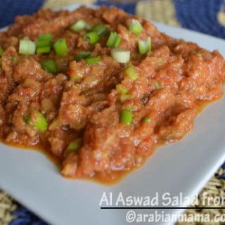 A plate of food with Al Aswad salad