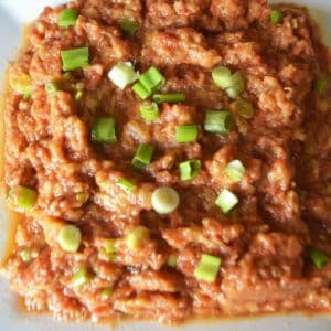 Al aswad salad on a white plate.