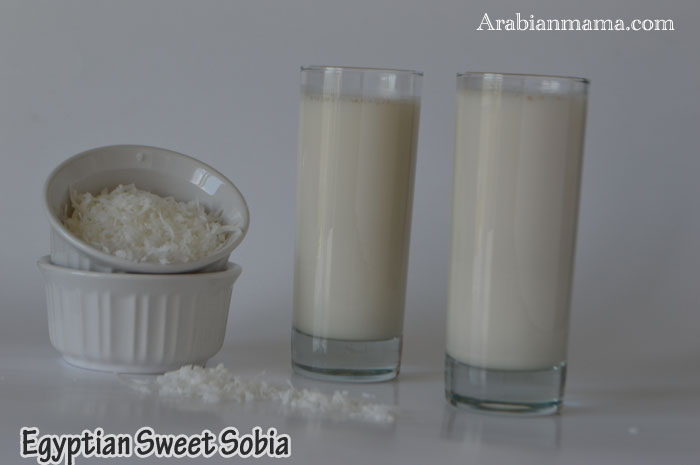 A photo showing two glasses of Sobia drink on a table, and cup of coconut