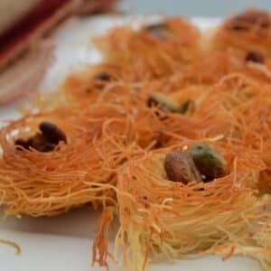 Kunafa nests on a white plate.