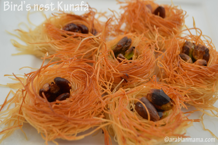 A close up of knafeh like bird\'s nest with nuts