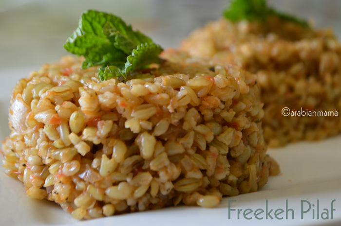 A close up of a plate of food with Freekeh