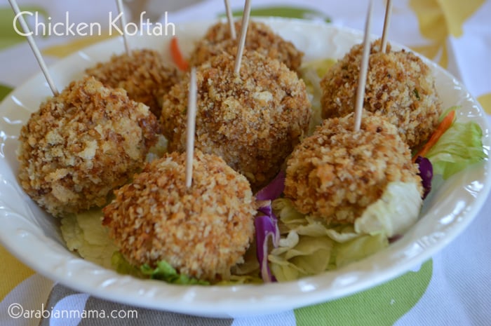 A plate is filled with Chicken kofta and sticks