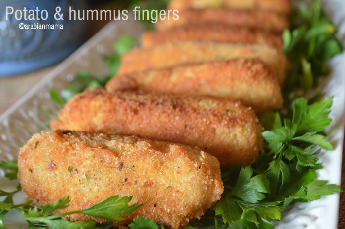 A close up of a plate of food, with Hummus Potato fingers