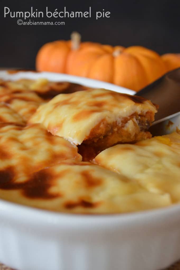 A close up of food showing a knife and pumpkin pie with bechamel on top
