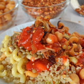 A plate of food with Quinoa, lentils and tomato sauce