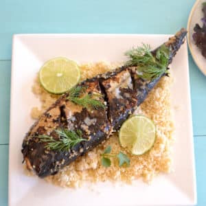 Mackerel fish on a bed of couscous.