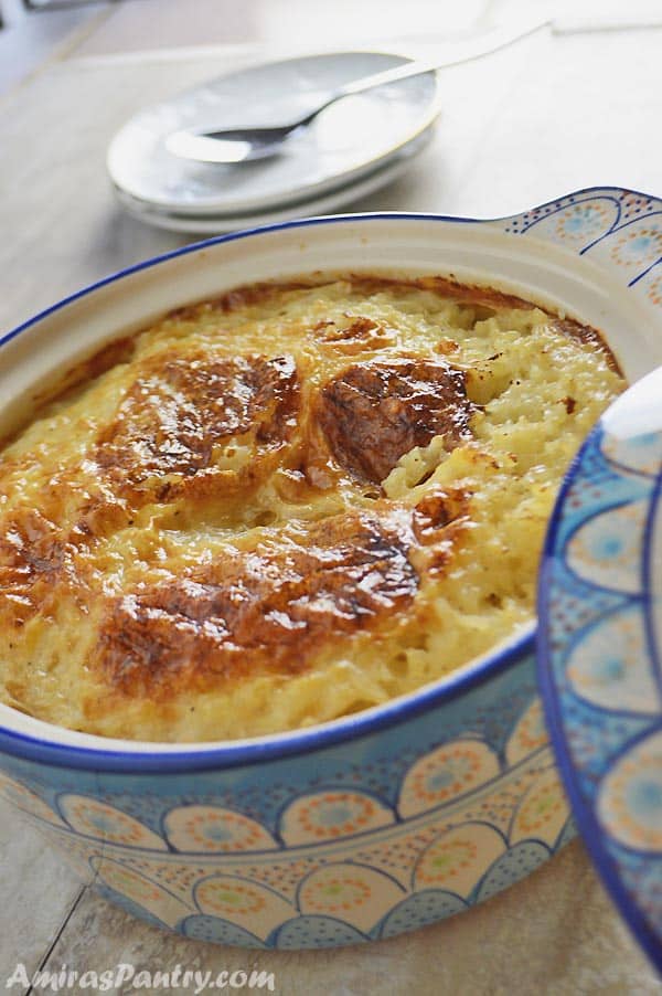 A close up of a bowl of food, with Rice pudding