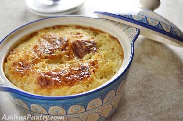 A close up of a bowl of food, with Rice pudding