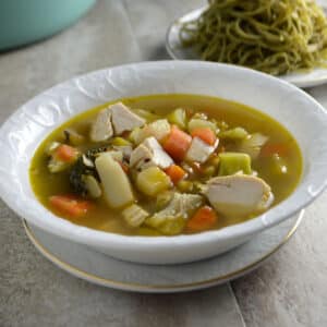 LEFTOVER SOUP ON A WHITE BOWL.