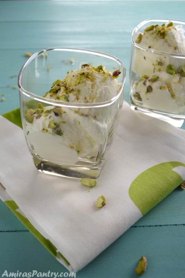 Two cups of Lebanese Booza ice cream spronkled with pistachios.