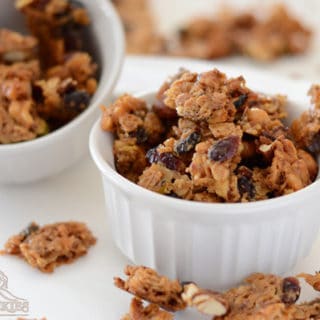 A small bowl of food on a plate, with Granola bites