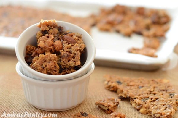 two nestled ramekins with the top filled with baklava granola chunks.