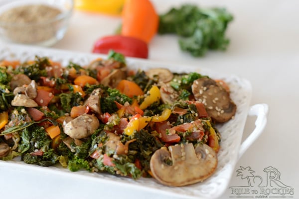 A plate of food on a table, with Kale and Mushroom