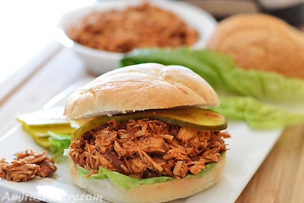 An easy and quick bbq pulled chicken sandwiches recipe for your next party, throw everything in the slow cooker and let it do its magic.
