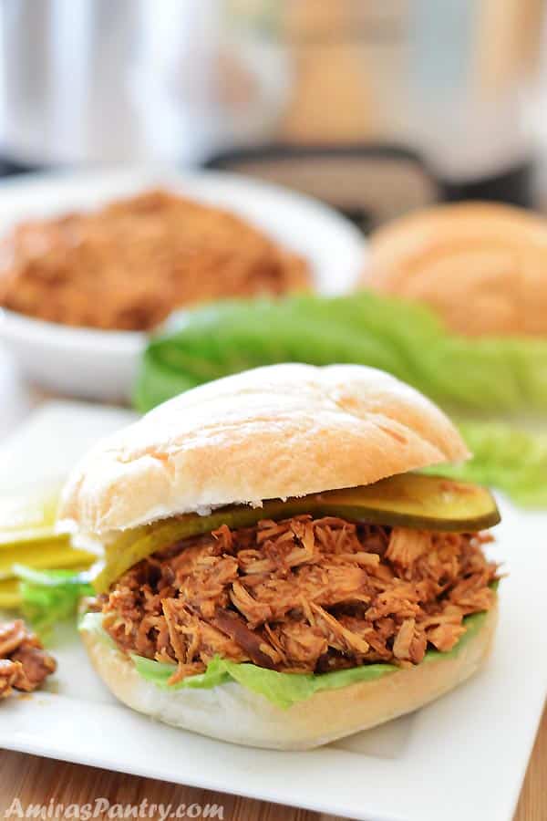 An easy and quick bbq pulled chicken sandwiches recipe for your next party, throw everything in the slow cooker and let it do its magic.