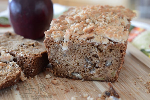 A piece of bread loaf on a wooden board