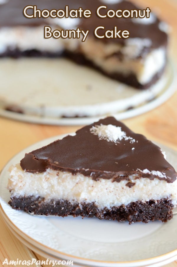 a piece of bounty cake placed on a white plate on a wooden surface.