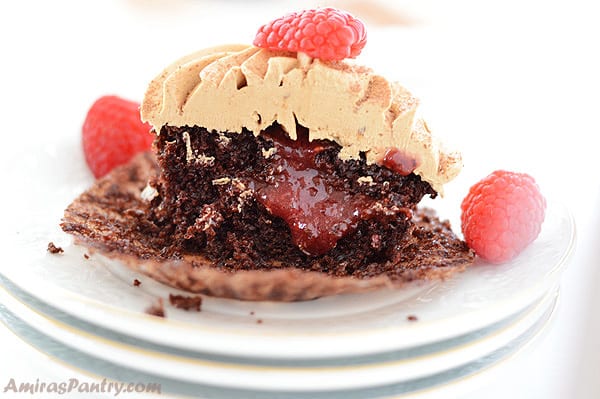 Coffee cupcakes cut in half showing the raspberry filling