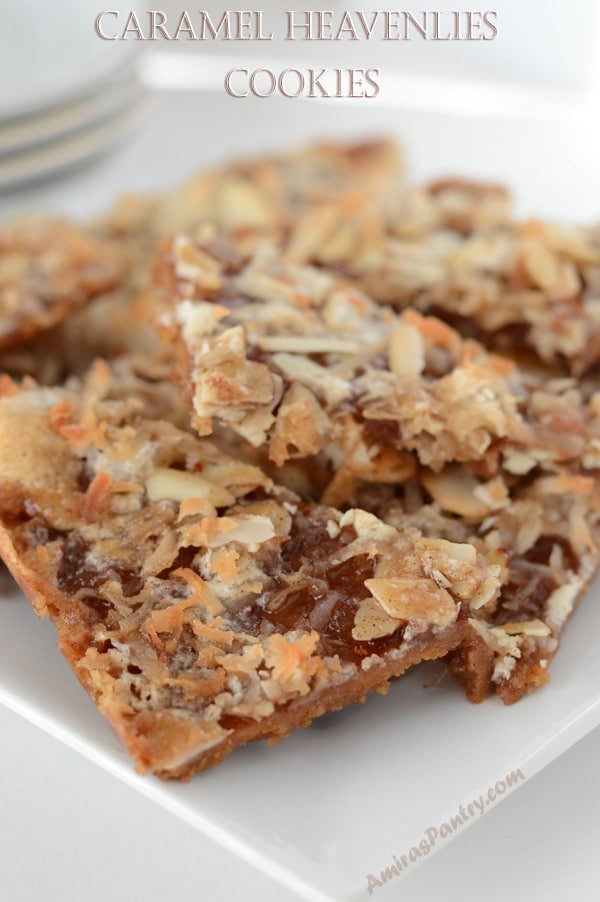 A close up of a cookie with nuts on top of a plate