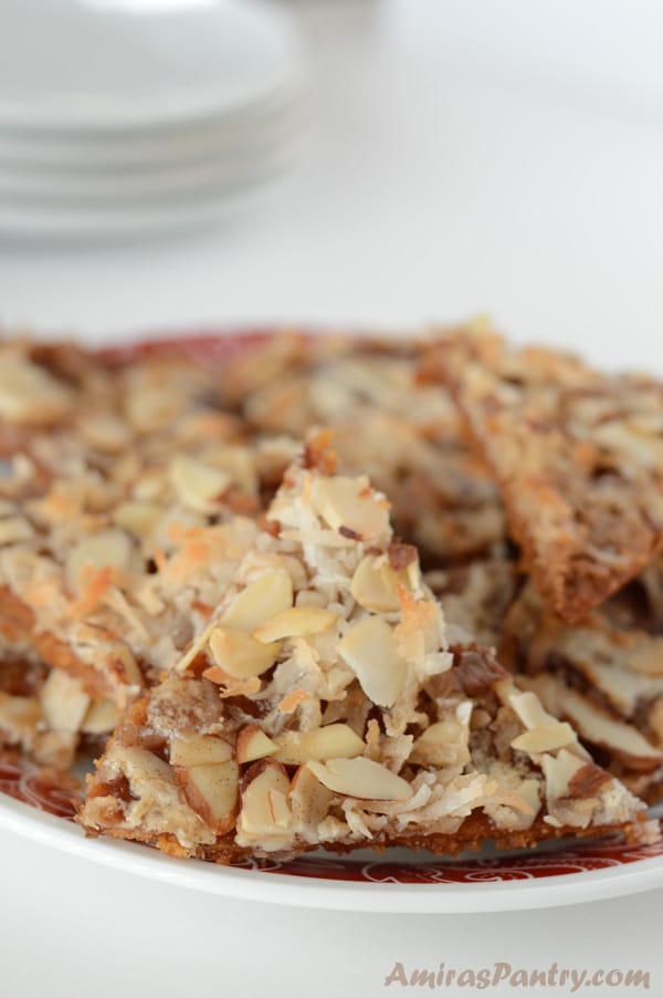 A close up of food on a plate, covered with nuts