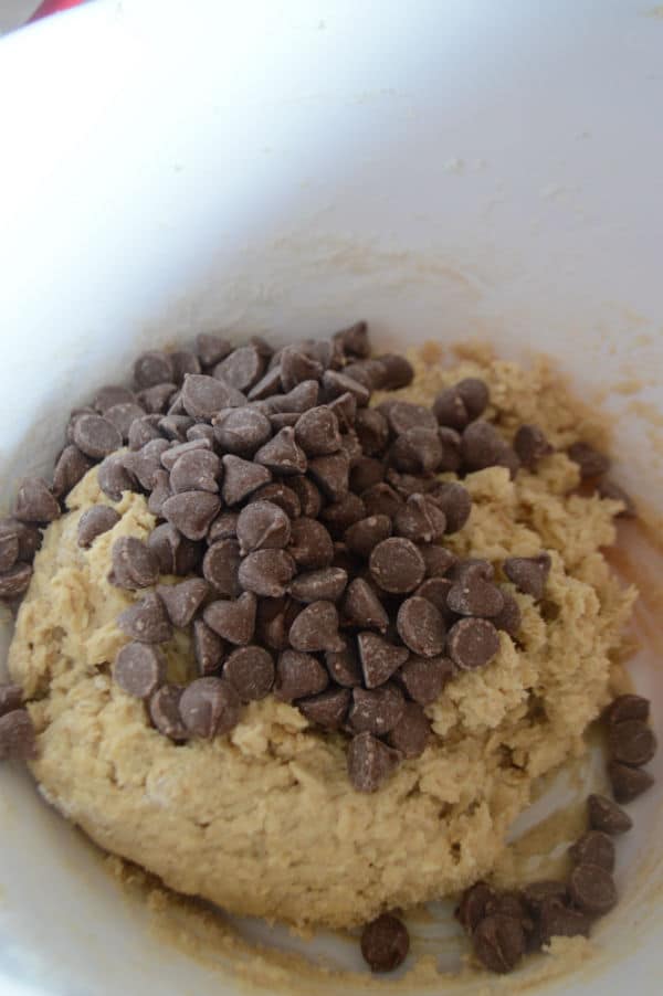 A photo showing a bowl of dough and chocolate chips