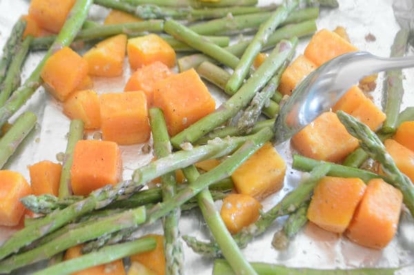 A pan is filled with food, with Butternut squash and vegetables