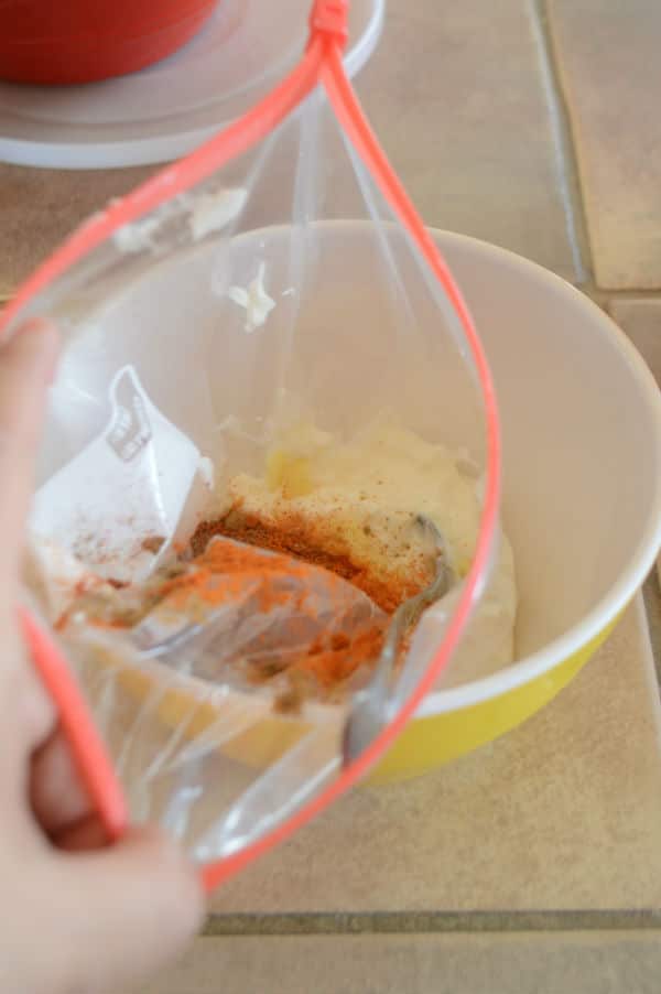A bowl with a bag filled with mixture