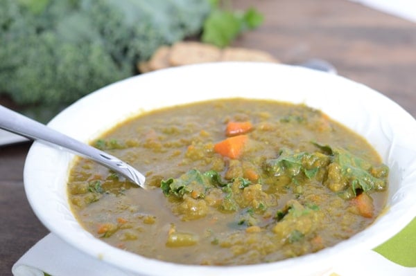 A bowl of kale soup with vegetables