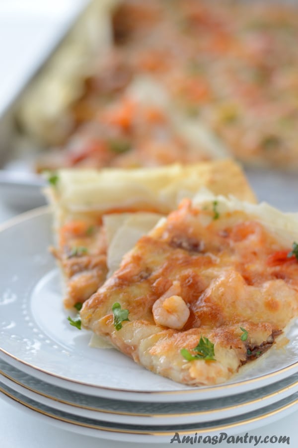 A close up of a plate of food, with Pizza slice