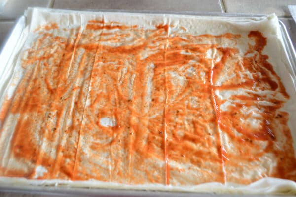 A photo showing sheets of pastry and sauce