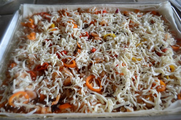 A pan is filled with food, with Shrimp cheese and vegetables