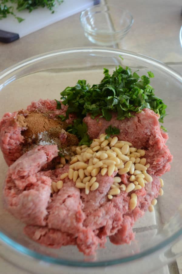 A bowl of food on a table, with ground beef and mixture