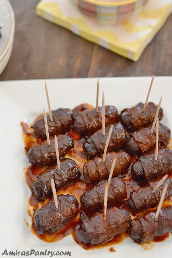 A plate filled with lots of Turkey Bacon wraps