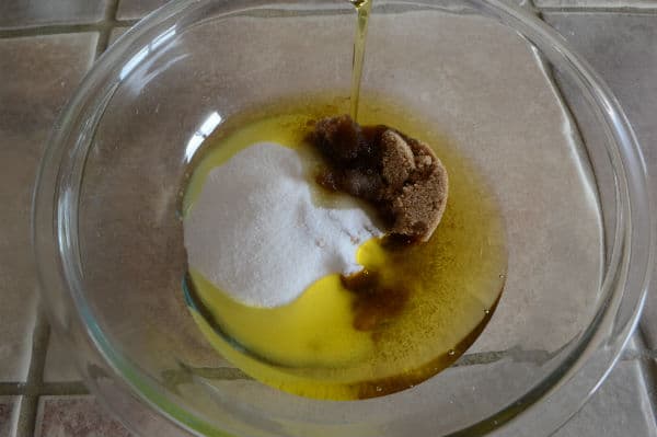 A photo showing a bowl with a mixture and oil