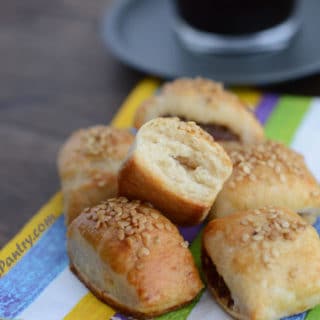 A plate of food with colored towel and cookies