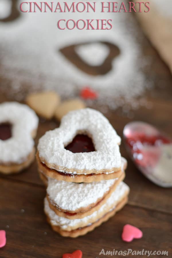 A close up of a heart cookie with sugar on top