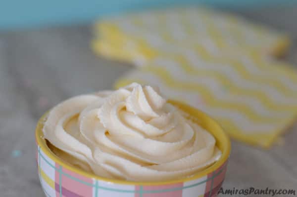 Fluffy marshmallow buttercream piped in a small bowl