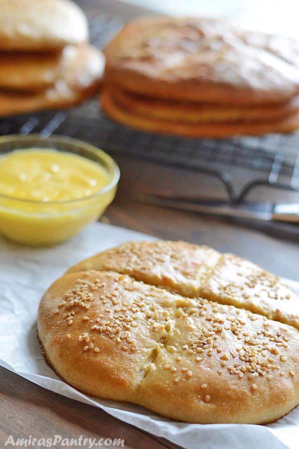 A close up of a Moroccan bread sitting on top of a wooden table