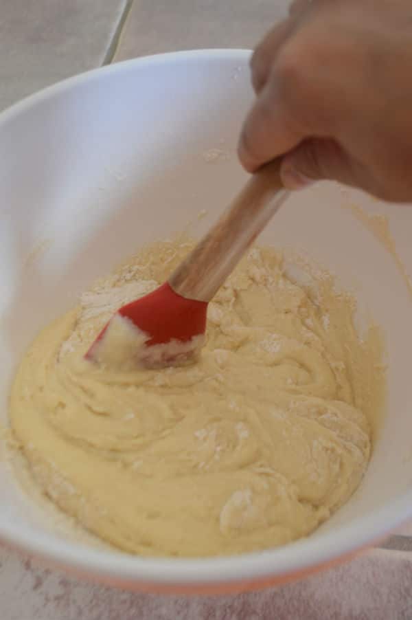 A photo showing a bowl with a mixture and dough