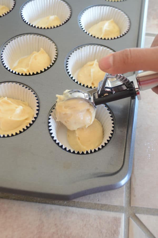 A photo showing a pan with a mixture and paper cups