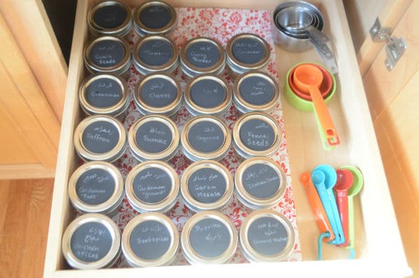 A photo for spices glass containers on a shelf