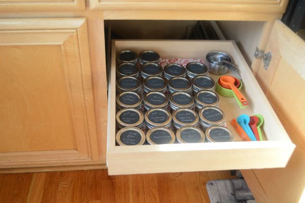 A photo for spices glass containers on a shelf