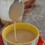A cup of Tahini paste on a table