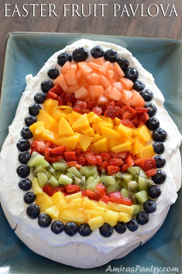 A close up of cake on a plate with fruits