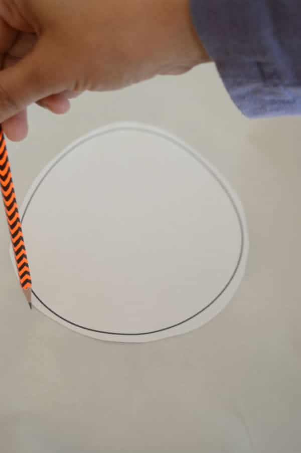 Hand drawing circle on a paper