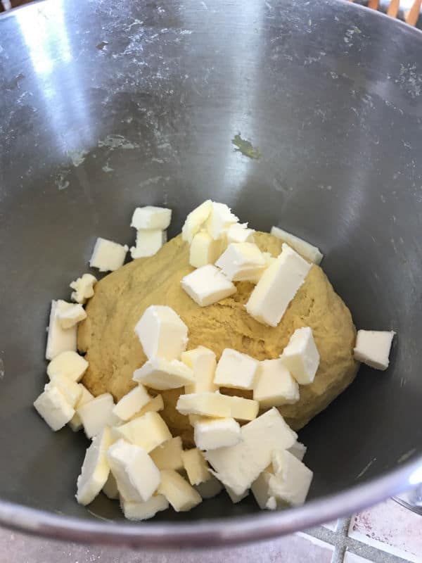 A bowl with dough and butter